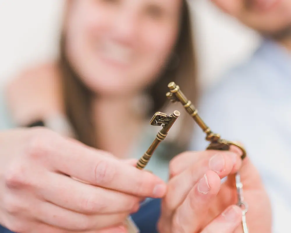 A set of house keys being handed over